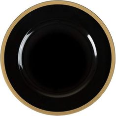 an empty black and gold plate on a white background