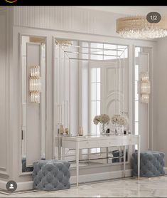 a white dressing table and chairs in a room