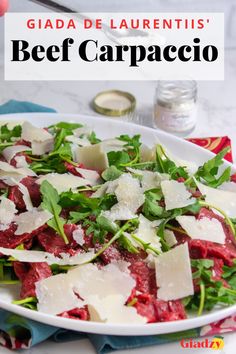 White oval plate with arugula, parmesan cheese and thinly sliced beef. Cold Beef Appetizers, Vegetable Carpaccio, Beef Carpaccio Appetizers, Steak Carpaccio, Beef Carpaccio Salad, Yellowtail Carpaccio, Beef Carpaccio Recipe, Carpaccio Recipe, Wine Appetizers