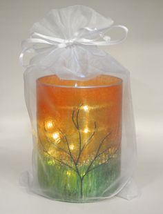 an orange candle in a clear plastic bag