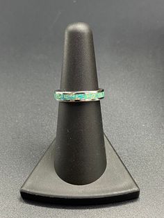 This beautiful handcrafted Stainless Steel comfort band is a real conversation starter! It features a Spring Green Opal inlay in the center of the ring. The crushed Opal is placed by hand, incased in resin, and then finished and polished to a brilliant shine. Each ring I make is truly unique and no two are ever the same. These rings are made to order and are available in several sizes. Use the drop down boxes to choose your ring size and width. Please allow 3-5 days for me to complete your ring. Artisan Rings With Inlay For Anniversary, Green Inlay Rings For Anniversary, Adjustable Turquoise Ring With Inlay For Gift, Green Anniversary Rings With Inlay, Anniversary Green Inlay Rings, Adjustable Patina Jewelry For Anniversary, Artisan Rings With Patina And Adjustable Fit, Adjustable Inlay Jewelry Ring, Real Conversation