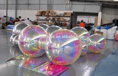 large inflatable balls are lined up on the floor