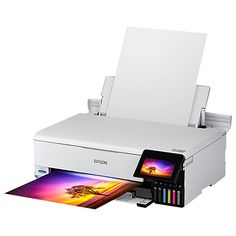 an epson printer is shown with the ink tray open and it's printing