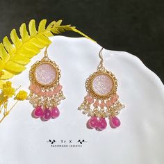 ♢ FEATURES & MATERIALS ~Cameo:pink mother of pearl,natural color,hand carved,15mm ~Pink Sapphire: natural color,9-10mm ~Rhodochrosite:natural color,3mm ~Pearl:natural color,2-3mm ~Materials: 14K Gold Filled This pair of gorgeous pink mother-of-pearl Cameos are hand-carved with vintage patterns. I paired them with pink sapphire droplets, rhodochrosite and freshwater pearls, which are exquisite and retro. All metals are filled with 14K gold filled and will not cause skin irritation. Length of earr Pink Chandelier Drop Earrings For Gift, Pink Dangle Chandelier Earrings As Gift, Handmade Pink Dangle Jewelry, Pink Pierced Earrings As Gift, Pink Chandelier Earrings For Gift, Pink Jewelry With Matching Earrings For Mother's Day, Pink Round Earrings For Valentine's Day, Elegant Pink Earrings For Festive Occasions, Pink Bohemian Jewelry For Valentine's Day