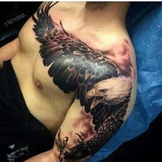 an eagle tattoo on the arm and chest