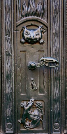 an ornate door with a cat face on it