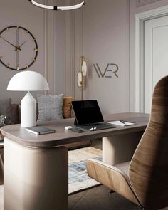 a desk with a laptop on it in front of a large clock and couches