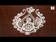 an intricately designed wooden box with white paint on it