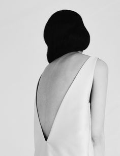 the back of a woman's dress in black and white