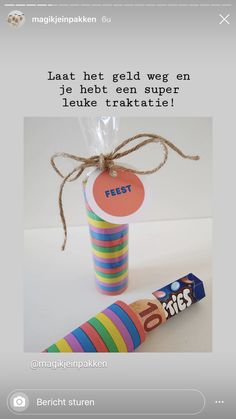 a candy bar wrapped in cellophane and tied with twine to the top