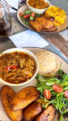 two plates filled with different types of food on top of a table next to each other