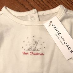 Janie And Jack “First Christmas” Onesie Slightly Off White Onesie Featuring Deer And “First Christmas” Embroidery Size: 6-12 Months 100% Cotton Machine Wash And Tumble Dry Low Sold At Nordstrom’s Nwt. Msrp $24.00 Cute White Top For Festive Occasions, First Christmas Embroidery, Cute Christmas Holiday Onesie, My First Christmas Matxhing Shirts, Newborn Christmas Onesie, First Christmas Onesie, Jack One Piece, My First Christmas Onesie Red, Baby’s First Christmas Ornament Embroidered