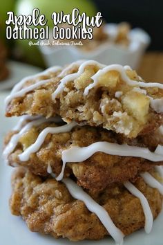 apple walnut oatmeal cookies stacked on top of each other with white icing