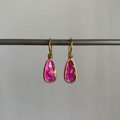 Organic in form, these rubies are packed with lush and lively pink personality. 18k yellow gold Rubies, 2.53ctw, 7mm x 12mm (1/4" x 1/2") Earrings hang 15/16" from the ear Each earring weighs 1.3g Gold Faceted Ruby Earrings, Pink Oval Ruby Earrings, Gold Pink Sapphire Earrings Fine Jewelry, Gold Pink Sapphire Earrings In Fine Jewelry Style, Yellow Gold Teardrop Ruby Earrings, Fine Jewelry Pink Sapphire Earrings In Yellow Gold, Elegant Yellow Gold Earrings With Pink Sapphire, Elegant Pink Sapphire Earrings In Yellow Gold, Yellow Gold Ruby Dangle Earrings