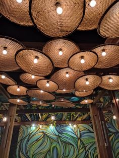 the ceiling is decorated with wicker baskets and lights