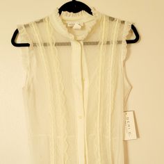 Sleeveless Sheer Blouse W/ Lace & Ruffle Detail Ivory Geri C New York Size Xl Tags On Fitted Sleeveless Lace Top With Ruffles, Chic Sleeveless Sheer Top, Summer Sleeveless Lace Top With Ruffles, Spring Sleeveless Lace Top With Ruffles, Chic Sleeveless Lace Top Blouse, Sleeveless Ruffled Lace Top For Spring, Chic Lace Sleeveless Blouse, Elegant Sleeveless Sheer Blouse, Cream Sleeveless Tank Top With Lace Trim