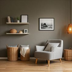 a living room filled with furniture and pictures on the wall next to baskets in front of a chair