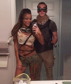 a man and woman standing in front of a bathroom mirror taking a selfie together