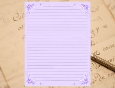 a notepad and pen on top of an old fashioned letter paper with writing in the background