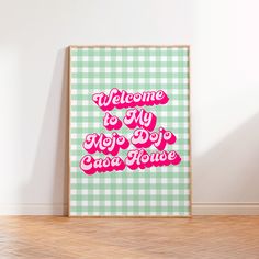 a green and white checkered wall with a pink sign that says welcome to my new dog and house