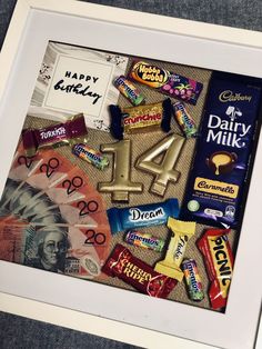 a framed photograph with candy and candies on it