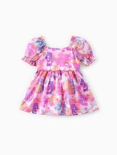 Adorable and dreamy, this Care Bears Toddler Dress will transport your little one to a magical world with its princess-style silhouette, puff sleeves, sparkling tulle, and lovely Care Bears print.
-Product features: Care Bears print.
-Fabric characteristics: Soft and comfortable.
-Piece of product: 1 dress.
-Sleeves: Puff.
-Style: Dreamy and lovely. Cute Toddler Outfits, Dress Sleeves, Princess Style, Care Bears, Bear Print, Baby Clothes Shops, Toddler Dress, Tulle Dress, Toddler Girls