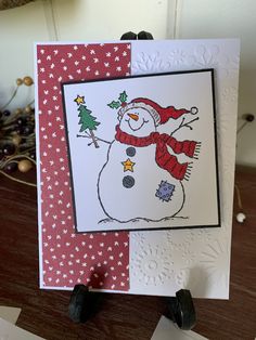 a handmade christmas card with a snowman on it