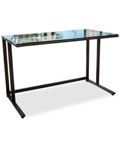 a glass top desk with metal legs and a black frame on an isolated white background