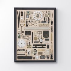 a framed display of various items on a white wall with black border around the edges