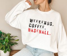 "Weekends Coffee Baseball Sweatshirt, Baseball Sweatshirt, Baseball Mom Sweatshirt Sweatshirt for Women Game Day Sweatshirt, Sports Mom. Sweatshirt for women, Gift for mom, Gift for her, Sweatshirt, Mothers Day gift, Women's sweatshirt, Baseball mom, Sports mom life.    HIGH QUALITY GILDAN SWEATSHIRT How to order: 1- Select your size 2- Select your color 3- Select the Quantity 4- Click \"Add to cart\" button Note: For multiple items go back to the listing and repeat the steps above SIZE AND COLORS: * Unisex Sizing * Tear away label * Soft & Stylish * Retail fit PROCESSING TIME: The standard processing time is 1-3 business days. (We usually process and ship out the orders within 2 business days.) SIZING: * For sizes, please refer to the listing image. CARE INSTRUCTION: Turn garment inside o Sporty Graphic Print Tops For The Weekend, White Long Sleeve Sweatshirt For Weekend, Sporty Letter Print Tops For Weekend, Sporty Weekend Tops With Letter Print, Sporty Tops With Letter Print For Weekend, Sporty Cotton Tops With Letter Print For Weekend, Sporty Tops For Weekend, Weekend Crew Neck T-shirt, Weekend White Crew Neck Sweatshirt