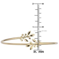 A charming gold bangle bracelet for women that is beautifully crafted of genuine 14k yellow gold and showcases a gold bypass bangle bracelet style and exhibits an olive branch design. This stunning gold cuff bangle bracelet compliments your casual or formal ensemble, which makes it an excellent addition to your jewelry