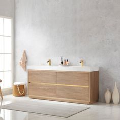 a bathroom with a sink, mirror and rug