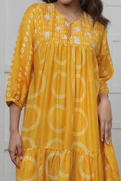 Shop for Myoho Yellow Cotton Silk Discharge Print Tiered Dress for Women Online at Aza Fashions Cotton Smock Tiered Dresses, Cotton Tiered Smock Dress, Festive Ikat Print Tunic Dress, Spring Yellow Dresses With Printed Motifs, Yellow Cotton Tiered Dress, Yellow Tiered Cotton Dress, Festive Yellow Printed Dress, Yellow Circle, Tiered Dress