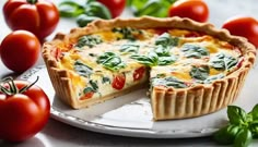 a quiche on a plate with tomatoes and basil