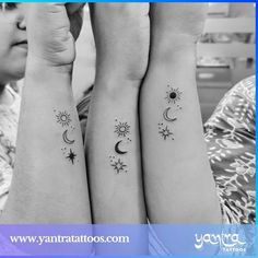 two girls with matching tattoos on their arms and wrist, both have sun and moon tattoo designs