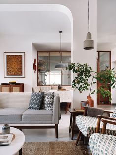 a living room filled with furniture and decor