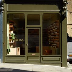 an empty storefront on the corner of a city street with no one in it