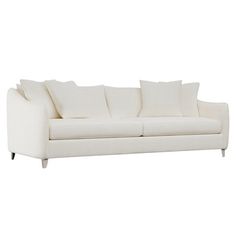 a white couch with pillows on it