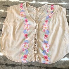 **Price Firm - Closet Clearance** Free People Peasant Blouse. Washed But Never Worn. Boho Fit And Style. Runs Loose And Large But Short On Torso. Delicate Button Details With “Ruffle” Design Down The Front And Back. Slits On The Sides To Allow Belts And Waistband To Show. Please Review Photos. Priced To Sell Summer V-neck Blouse With Floral Embroidery, Spring Festival V-neck Blouse, Sleeveless Floral Embroidery Vacation Blouse, Summer Floral Embroidery Blouse For Daywear, Summer Blouse With Floral Embroidery For Daywear, Pink Floral Embroidered Blouse For Daywear, Floral Embroidery Blouse For Summer Daywear, Pink Sleeveless Top With Floral Embroidery, Bohemian Sleeveless Tops For Daywear