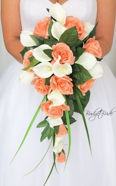 a bride holding a bouquet of orange and white flowers