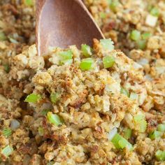 baked stuffing in a casserole dish with a wooden spoon and text overlay