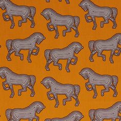 an orange background with black and white horses on it