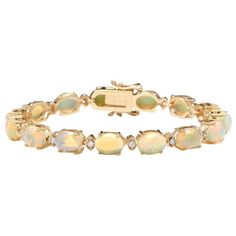 Very Impressive 20.00 Carats Natural Ethiopian Opal & Diamond 14k Solid Yellow Gold Bracelet Suggested Replacement Value: $12,900.00 Stamped: 14k Total Natural Round Diamonds Weight: 1.10 Carats (Color F-G / Clarity Vs2-Si1) Total Natural Opals Weight Is: 18.90 Carats Opal Measure: 9 X 7mm Bracelet Length Is: 7 Inches Bracelet Width: 7mm Bracelet Total Weight: 19.2g Sku #Tf223 Yellow Gold Bracelet, Natural Opal, Solid Yellow, Ethiopian Opal, Womens Jewelry Bracelets, Round Diamonds, Jade, Gold Bracelet, Opal