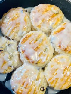 a pan filled with donuts covered in icing