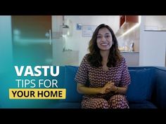 a woman sitting on top of a blue couch in front of a tv screen with the words vastu tips for your home