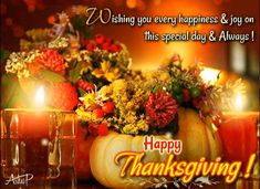 a thanksgiving greeting with candles and flowers