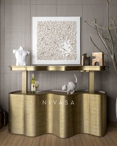 a living room with gold furniture and a painting on the wall above it that says nivasa