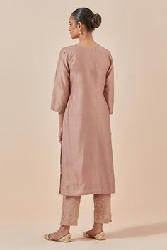 Dust pink straight kurta in chanderi silk base with floral embroidered hem. Comes with embroidered hem pant and tissue organza dupatta.
Components: 3
Pattern: Embroidered
Type Of Work: Floral Pattern
Neckline: V-Neck
Sleeve Type: Straight Three Quarter
Fabric: Chanderi Silk, Tissue Organza
Color: Pink
Other Details: 
Attached lining
Embroidered hem pant
Elasticated back waistband
Fringed hem, embroidered dupatta
Length:
Kurta: 47 inches
Pant: 37 inches
Approx. product weight (in kgs): 1.5
Occasi Elegant Slub Silk Straight Kurta, Designer Silk Straight Kurta, Unstitched Slub Silk Churidar With Straight Kurta, Transitional Silk Straight Kurta, Festive Handloom Palazzo Set With Straight Kurta, Eid Tissue Silk Straight Kurta, Diwali Tissue Silk Churidar With Straight Kurta, Semi-stitched Cotton Silk Straight Kurta, Silk Straight Kurta With Cutdana