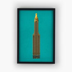 the empire building in new york city, ny framed in black wood frame on blue background