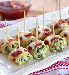 some food is being displayed on a plate and in the process of being cooked, then covered with sauces